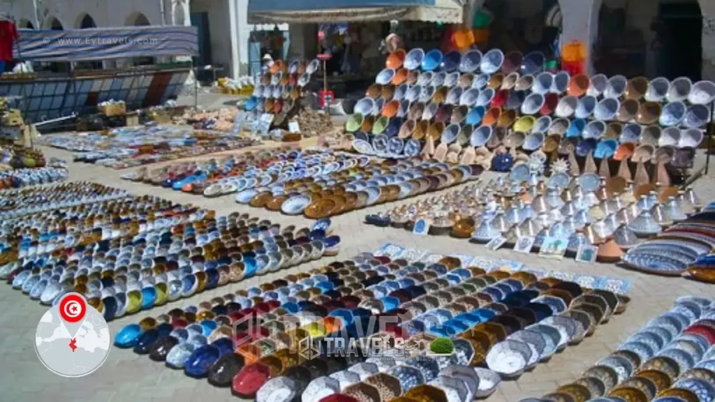 Must-See-Stops-in-tataouine-souk-tataouine Africa, Tunisia, Tataouine, Shoppers at Open Air Market, Sightseers viewing Pottery Display